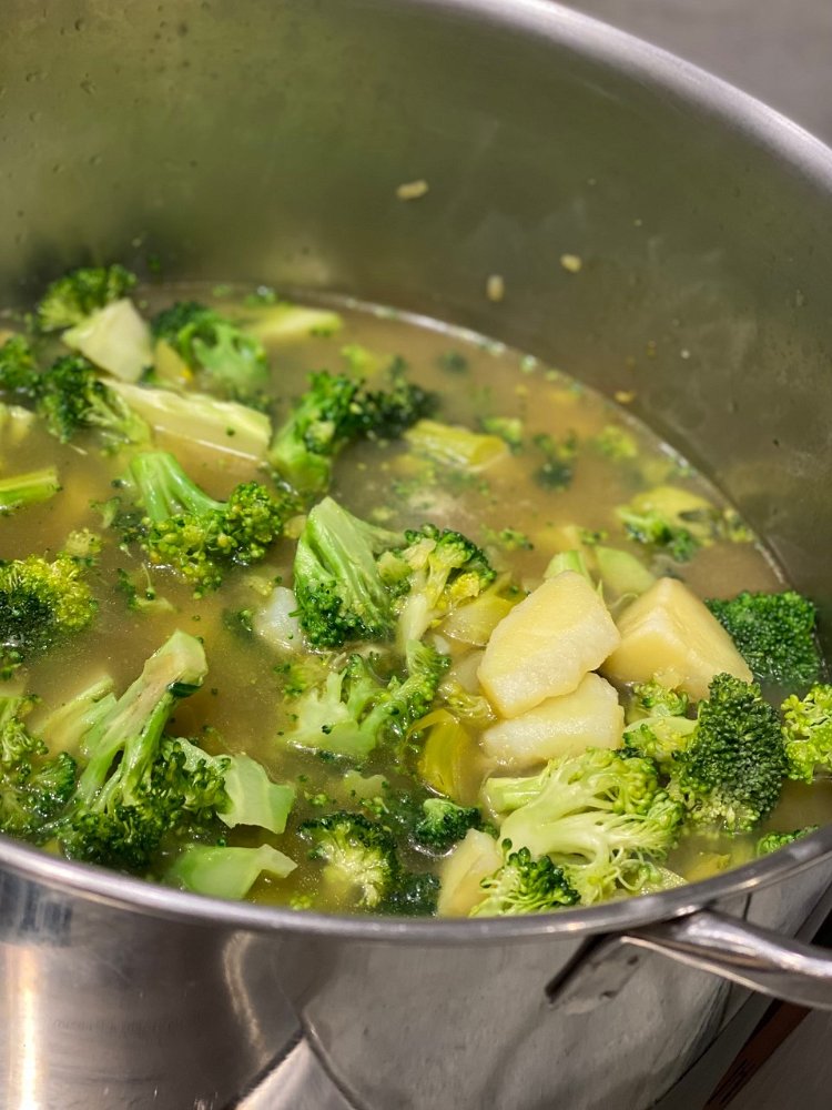 Image of Add the broccoli florets, stems and the chicken or vegetable...