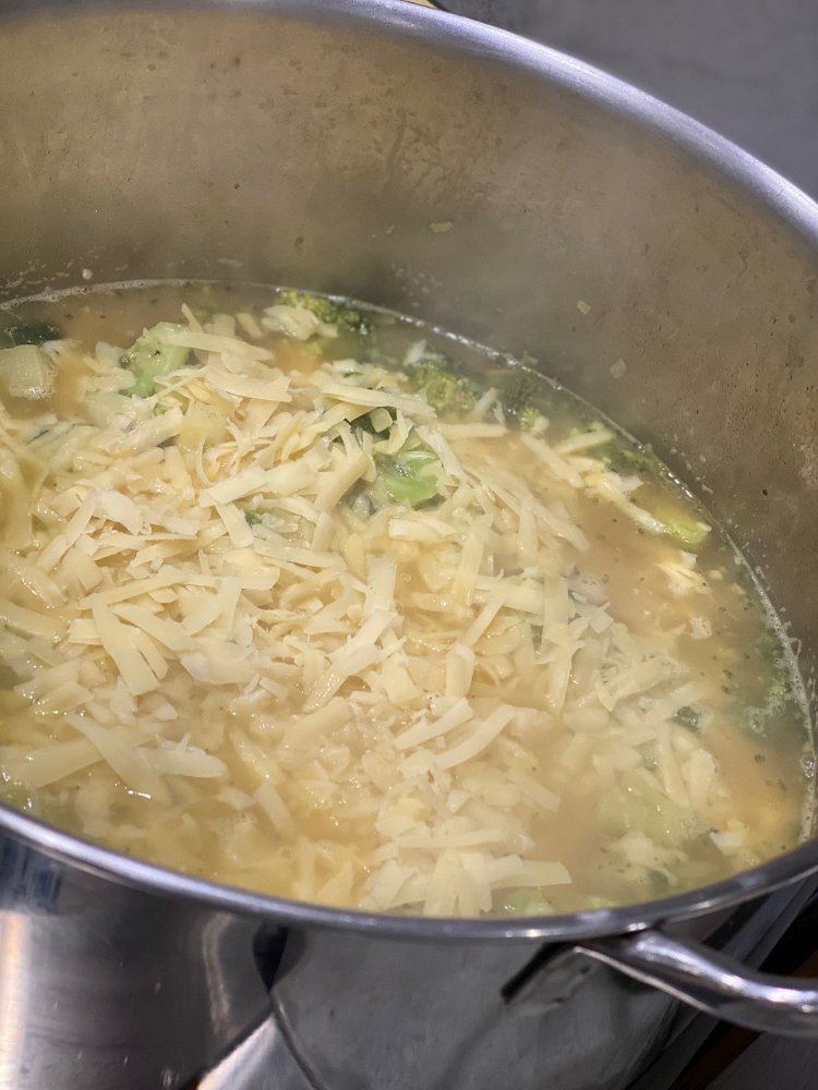 Image of Once done, add the shredded chedder cheese and stir to...