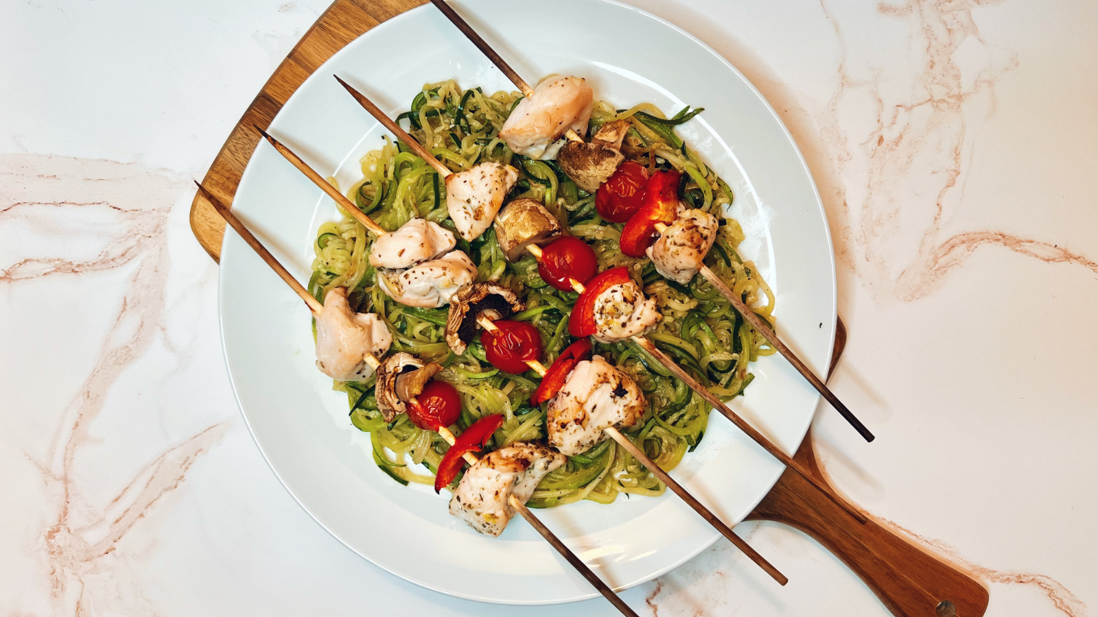 Image of Chicken and Veggie Kabobs Over Zoodles