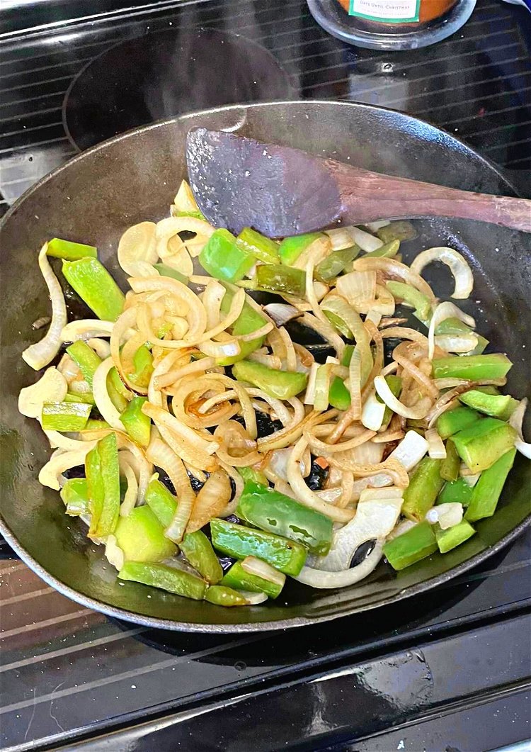 Image of Sauté some green peppers and onions.