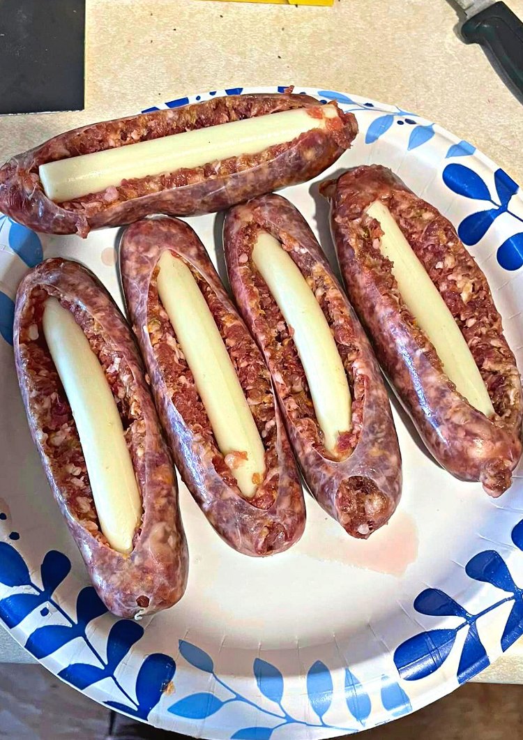 Image of Slice open the top of the sausage to create a...