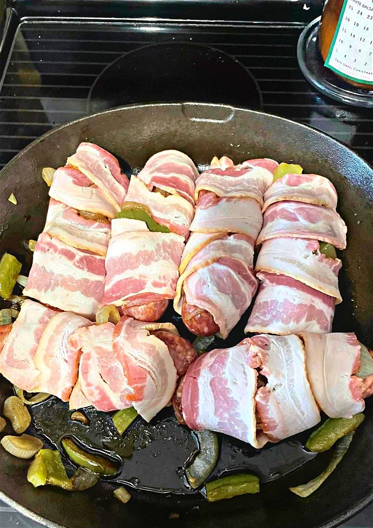 Image of Add in the bacon wrapped sausages to the pan and...