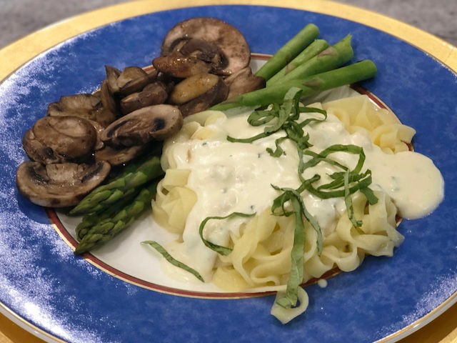 Image of Double Cheese Sauce over Pasta with Fresh Basil