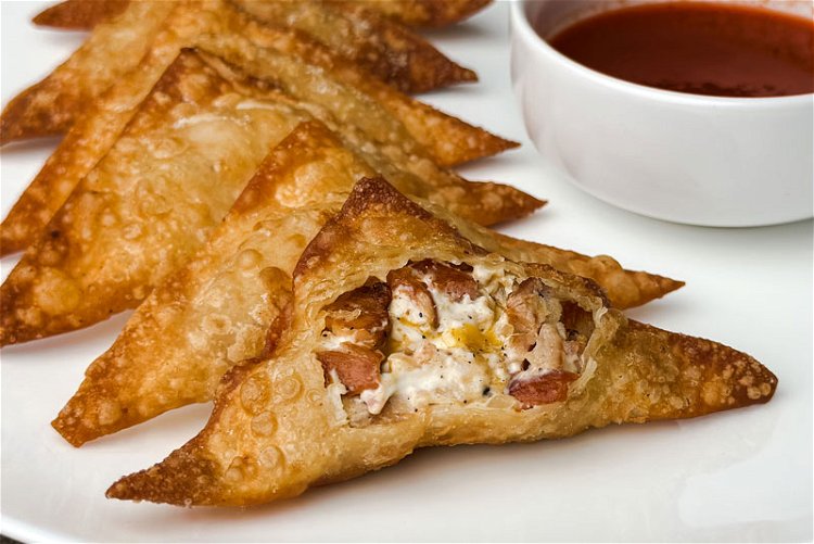 Image of Remove fried wontons and cool on a wire rack. Serve...