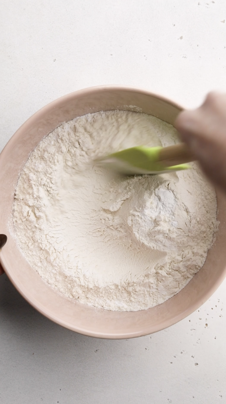 Image of In a large bowl, mix together the all purpose flour,...