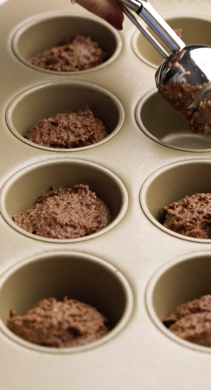 Image of Pour ¼ cup of batter into each individual muffin tin....