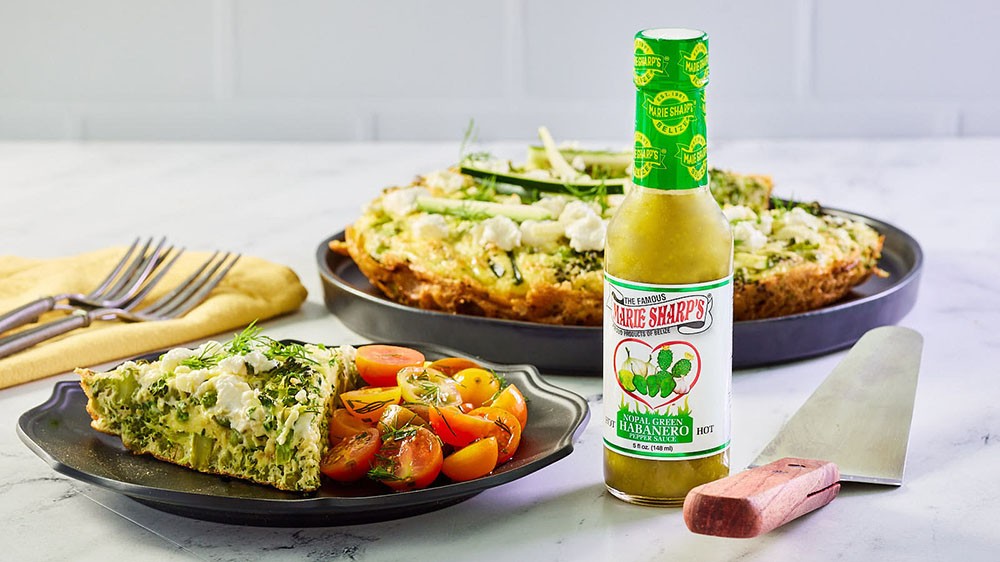 Image of Vegetable and Goat Cheese Frittata with Marie Sharp’s Green Habanero Pepper Sauce