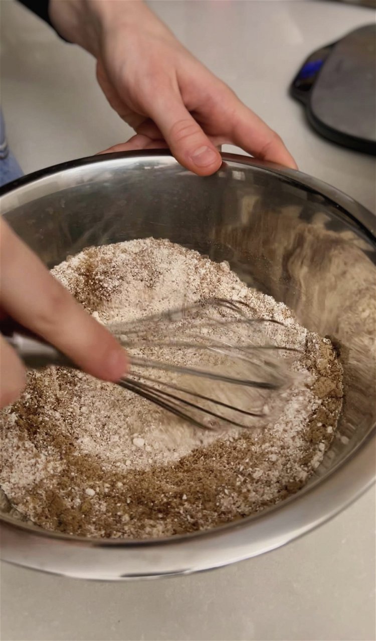 Image of In a bowl, combine the flour, sugar, baking powder, and...