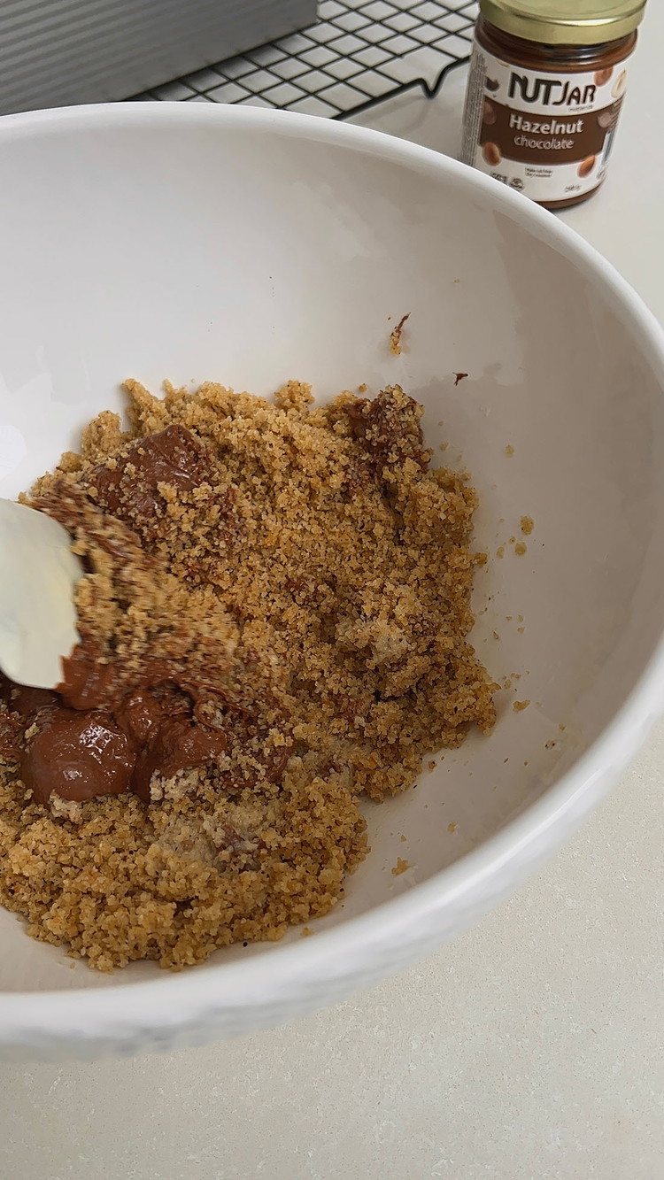 Image of Add the hazelnut-chocolate spread, milk, pinch of salt and mix everything to form a dough.