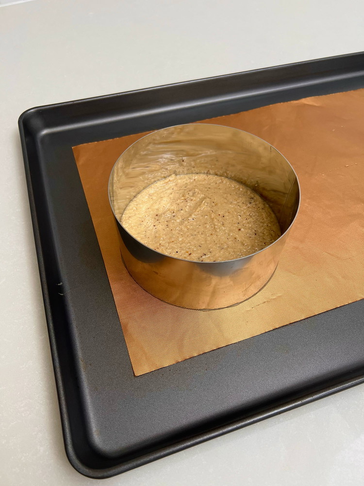 Image of Pour the batter into the baking tray lined with baking paper(don’t need any cake pans, because the mixture isn’t liquid).