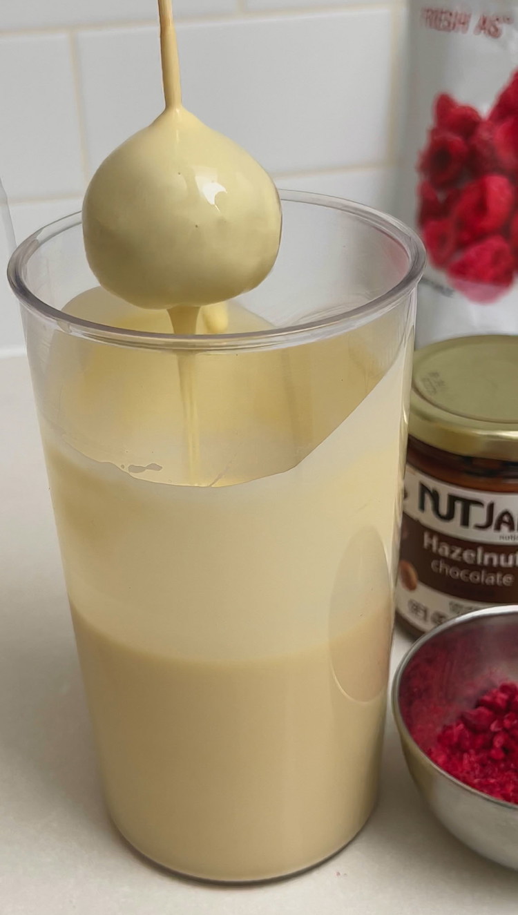 Image of Take the balls out of the freezer. Dip one end of the cake pop stick into a chocolate first and then insert it into the cake ball. Repeat with the remaining.
