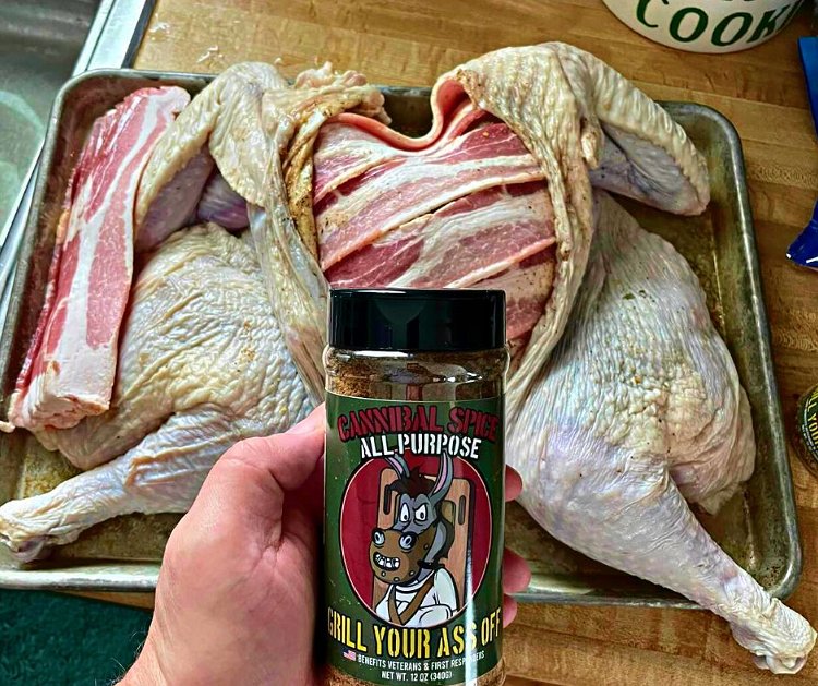 Image of Sprinkle Cannibal All Purpose Seasoning over the bacon-laced turkey.