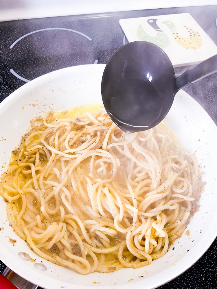 Image of Add about another ladle full of pasta water and toss...