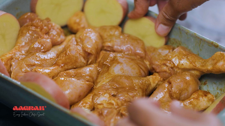 Image of Slice the potatoes and add them to the tray