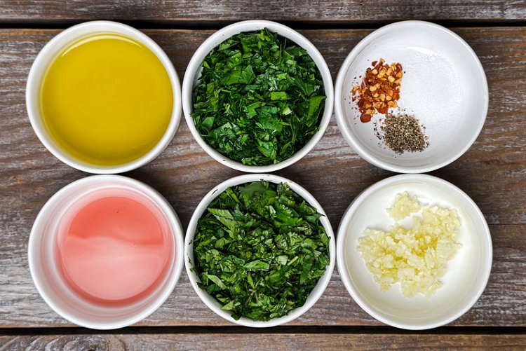 Image of Assemble the chimichurri by combining all the chopped ingredients in...