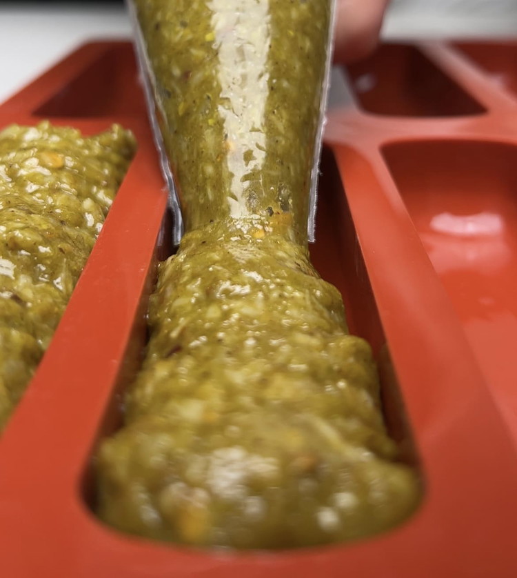 Image of Press the mixture evenly into your silicone mold. 