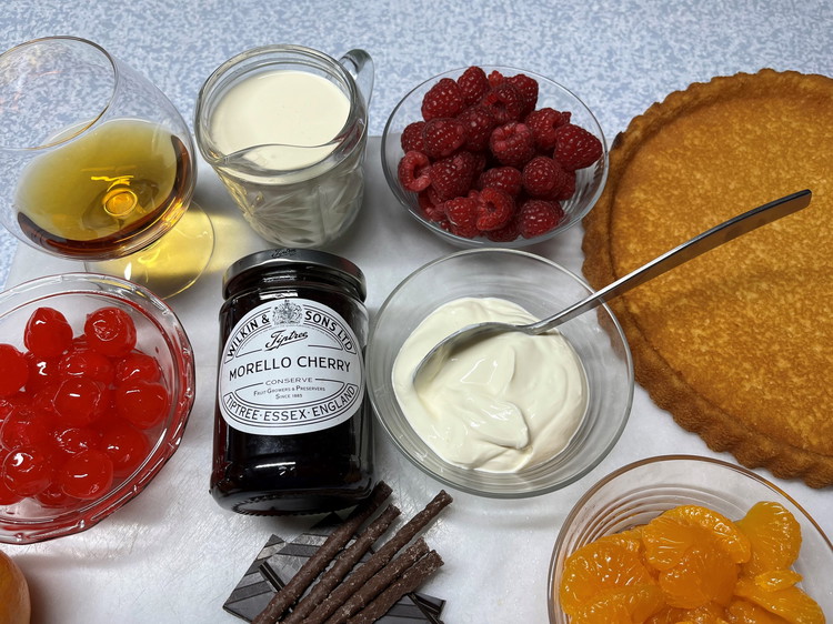 Image of Finish with cocktail cherries so they glisten round the edge.