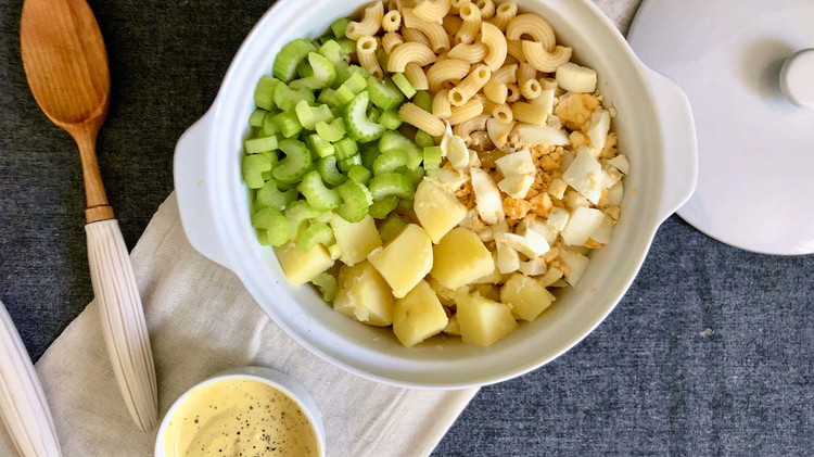 Image of Combine cooked macaroni, hard-boiled eggs, potatoes, and celery. Note: One cup of dry macaroni will make 2 cups cooked. Feel free to prepare these ingredients a day ahead of time for quicker preparation. 
