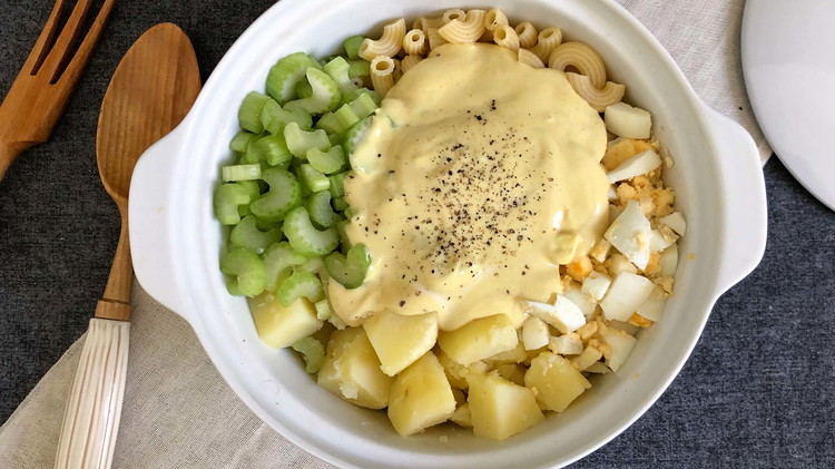 Image of Combine celery, macaroni, eggs, and potatoes with dressing. Combine well. 