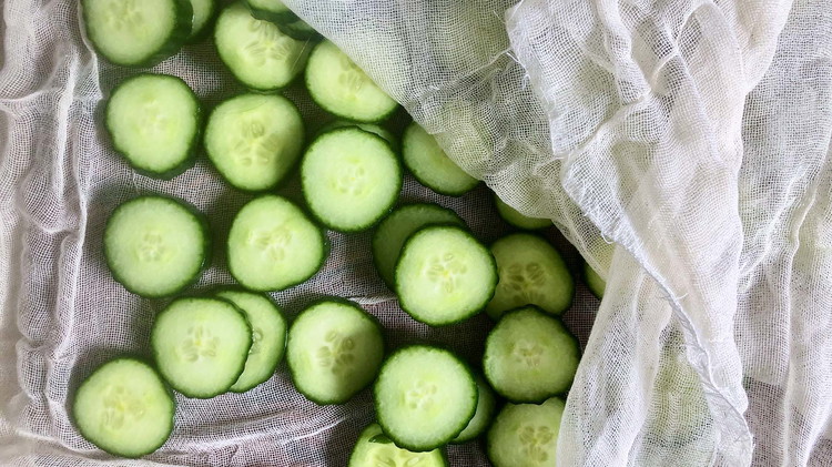 Image of Slice cucumbers and sprinkle with salt. Let cucumbers dry and remove excess water with a towel or cheesecloth. This will help the cucumber retain more flavor.