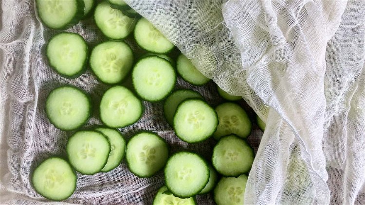 Image of Slice cucumbers and sprinkle with salt. Let cucumbers dry and...