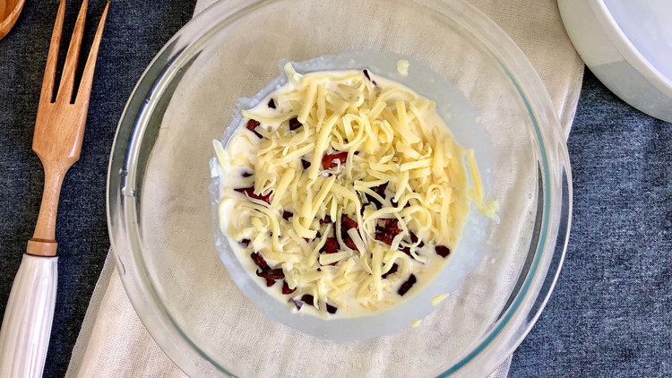 Image of Mix mayonnaise, sugar, onion, cheese, and crumbled bacon. Season to taste with salt and pepper.