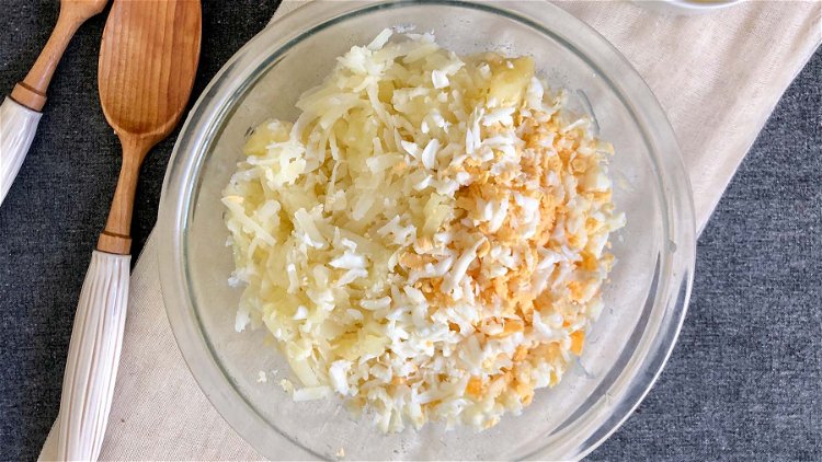 Image of Cook the peeled potatoes and eggs. Allow to fully cool...