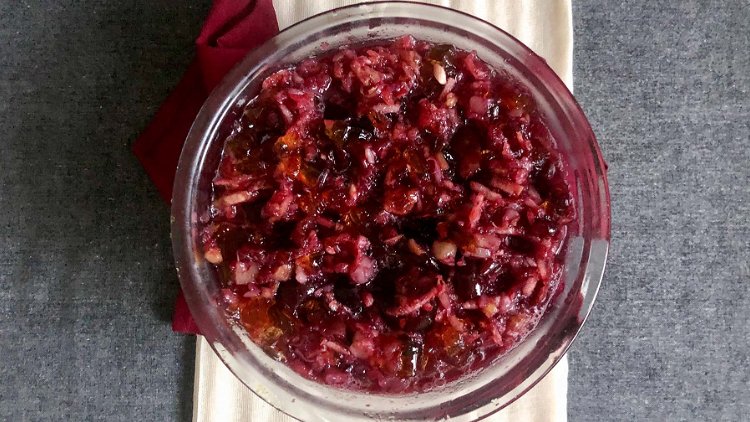 Image of Grind the cranberries and mix them with sugar. Let sit...