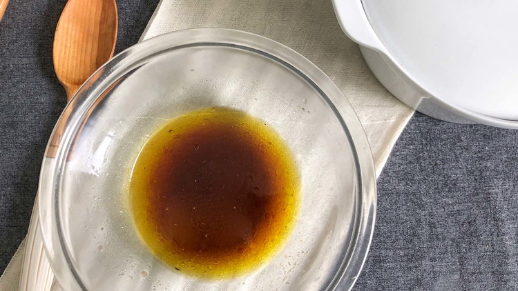 Image of In a medium bowl, mix sugar, vinegar, and vegetable oil together for Sauerkraut dressing. Whisk well before mixing with the sauerkraut mixture. Ensure all sugar is dissolved.