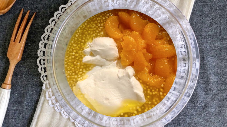 Image of Once fully cooled, transfer to a serving bowl and fold in orange, pineapple (optional), and thawed whipping topping. Combine well and refrigerate for 2-4 hours or overnight.