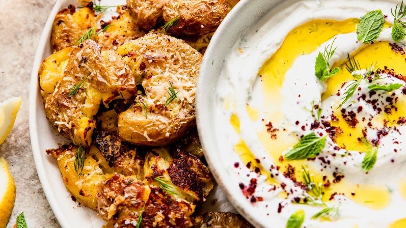 Image of Crispy Smashed Parm Potatoes with Garlic Yogurt Tahini Dip