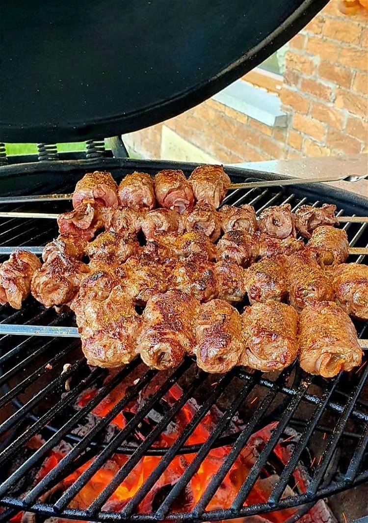 Image of Place a skewer with meat on it.  Grill and turn over...