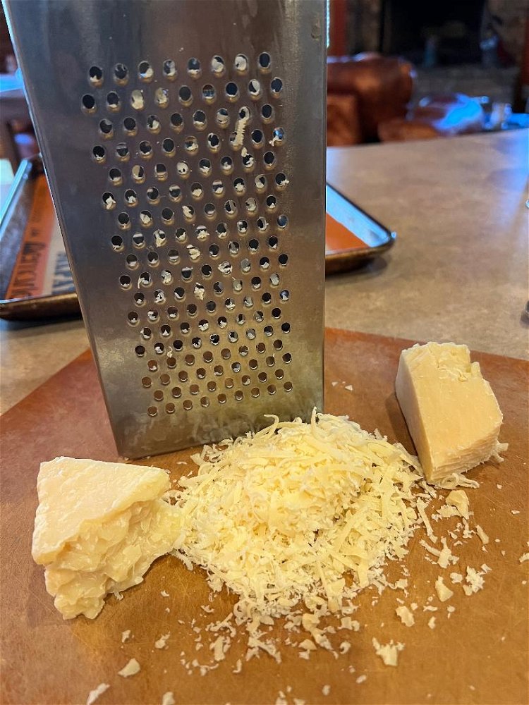 Image of Preheat oven to 375°.Grate Parmesan cheese on the smallest hole...