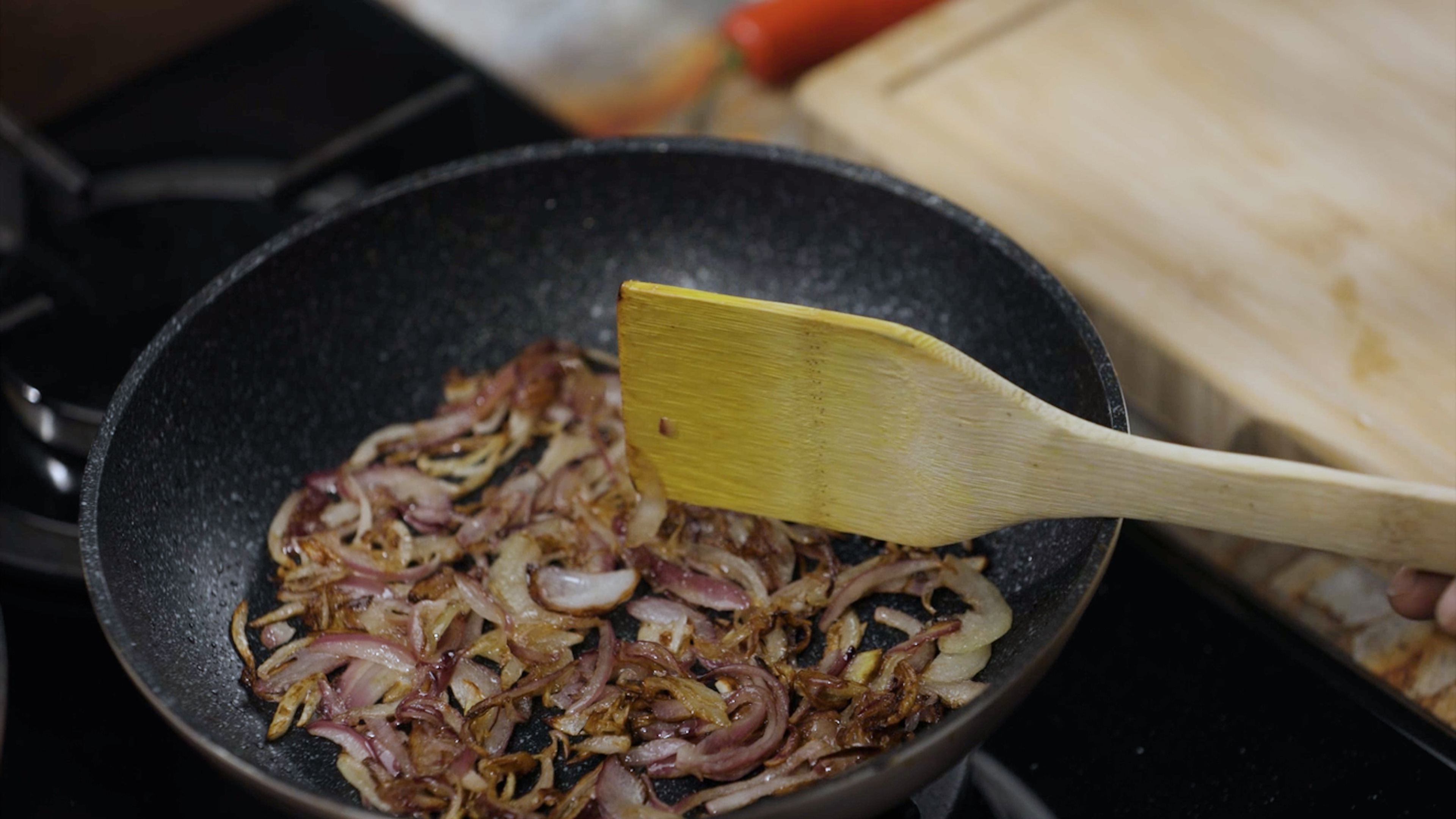 Image of  Fry onions until brown.