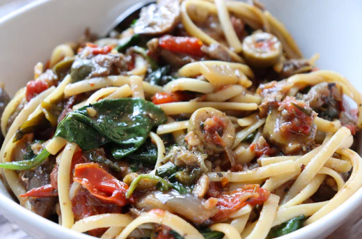 Image of Tuscan Chicken with Mushrooms over Linguini