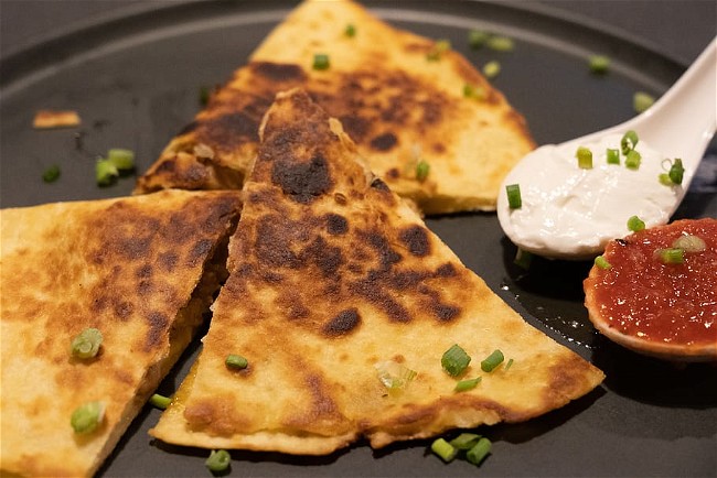Image of Quesadillas (tortillas filled with cheese and sometimes meat, vegetables, or beans)