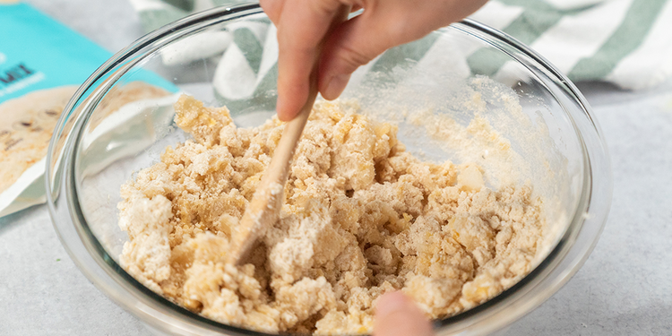 Image of Divide the dough in half and separate into two different bowls.