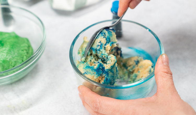 Image of Mix until desired color is reached.  Add more food coloring if needed. 