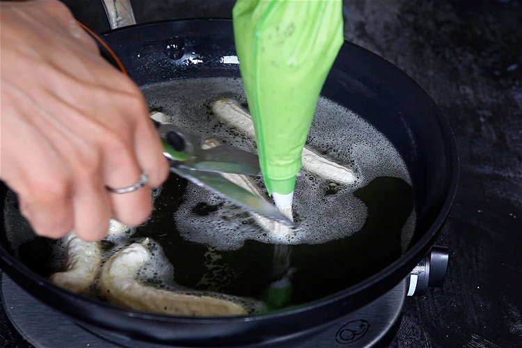 Image of pipe straight into the hot oil and snip at about...