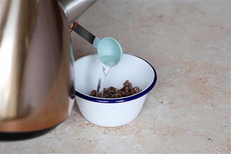Image of Boil a kettle. Snip open the sachet of dates. Empty...