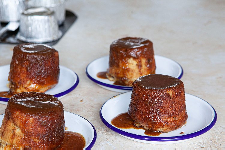 Image of Pure the remainder of the sauce equally onto each pudding.