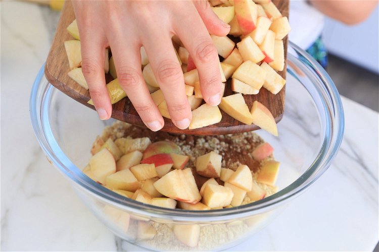 Image of Add the cinnamon, chopped apple and chopped walnuts.