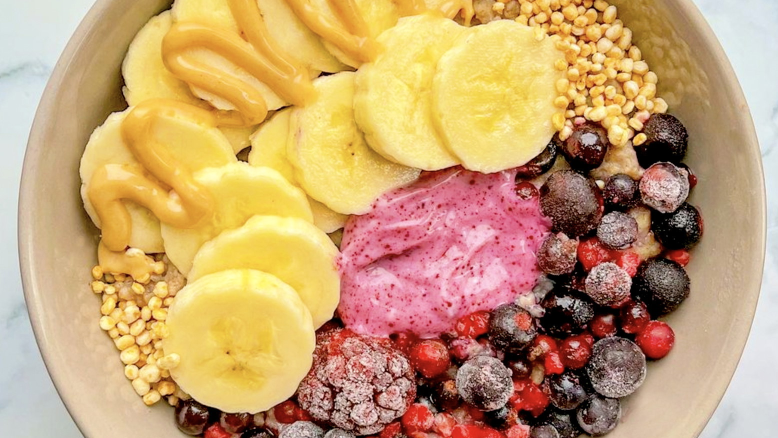 A colourful fruit breakfast bowl made using Haskapa