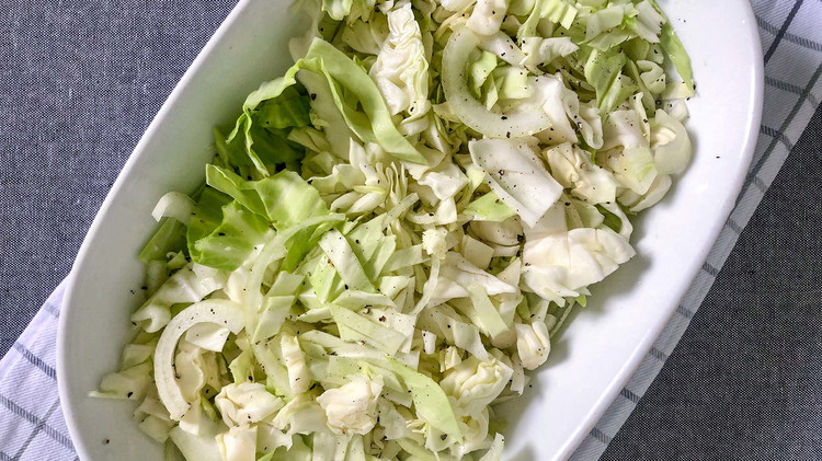 Image of Transfer cabbage and onions to a greased casserole dish.
