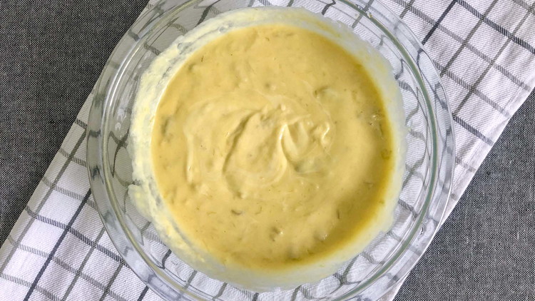 Image of In a separate bowl, mix together the condensed soup and mayonnaise. Spread over the cabbage mixture.