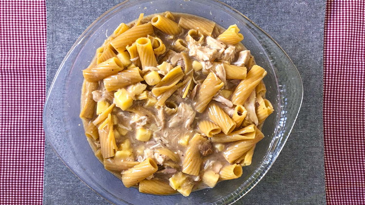 Image of Mix chicken with cream of mushroom soup, noodles, and cheese. If preferred, add reserved broth from noodles for a more liquidy mixture. Season with salt and pepper according to taste.
