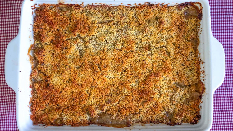 Image of Transfer the chicken mixture to greased 9x13 casserole pan. Top with an even layer of the breadcrumb mixture.