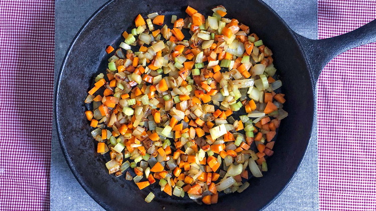 Image of In a large skillet, saute onions, carrots, and celery in butter or olive oil until tender.