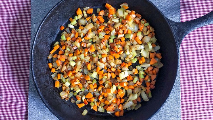 Image of In a large skillet, saute onions, carrots, and celery in...