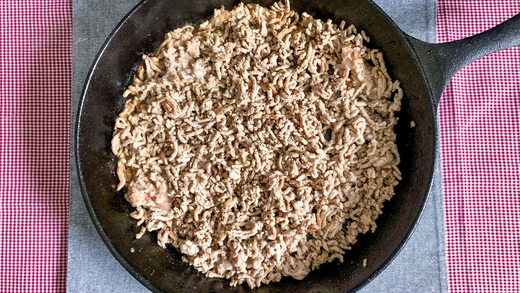 Image of Brown beef in butter with onion.